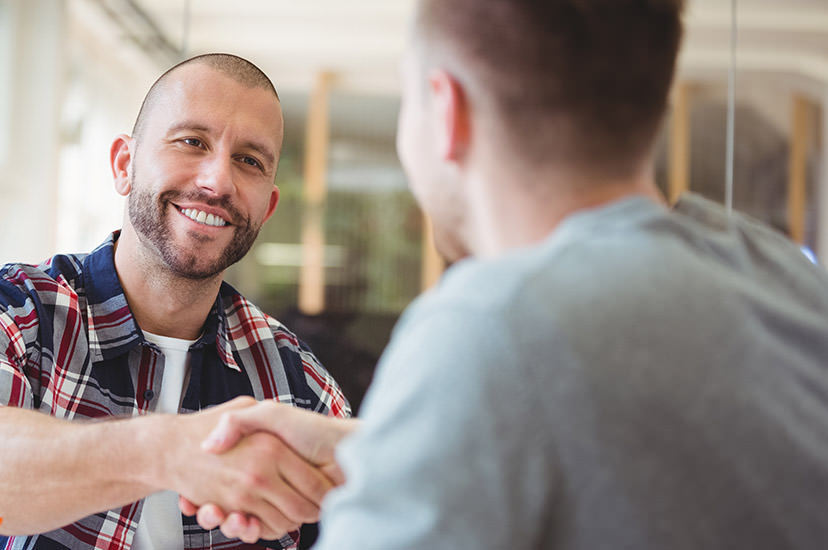 Two men and a handshake.